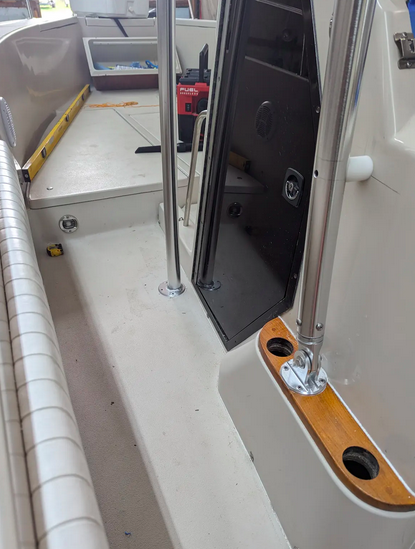Atlantic Towers T-Top installed on a Sea Ray boat, featuring polished metal supports and a clean interior deck.