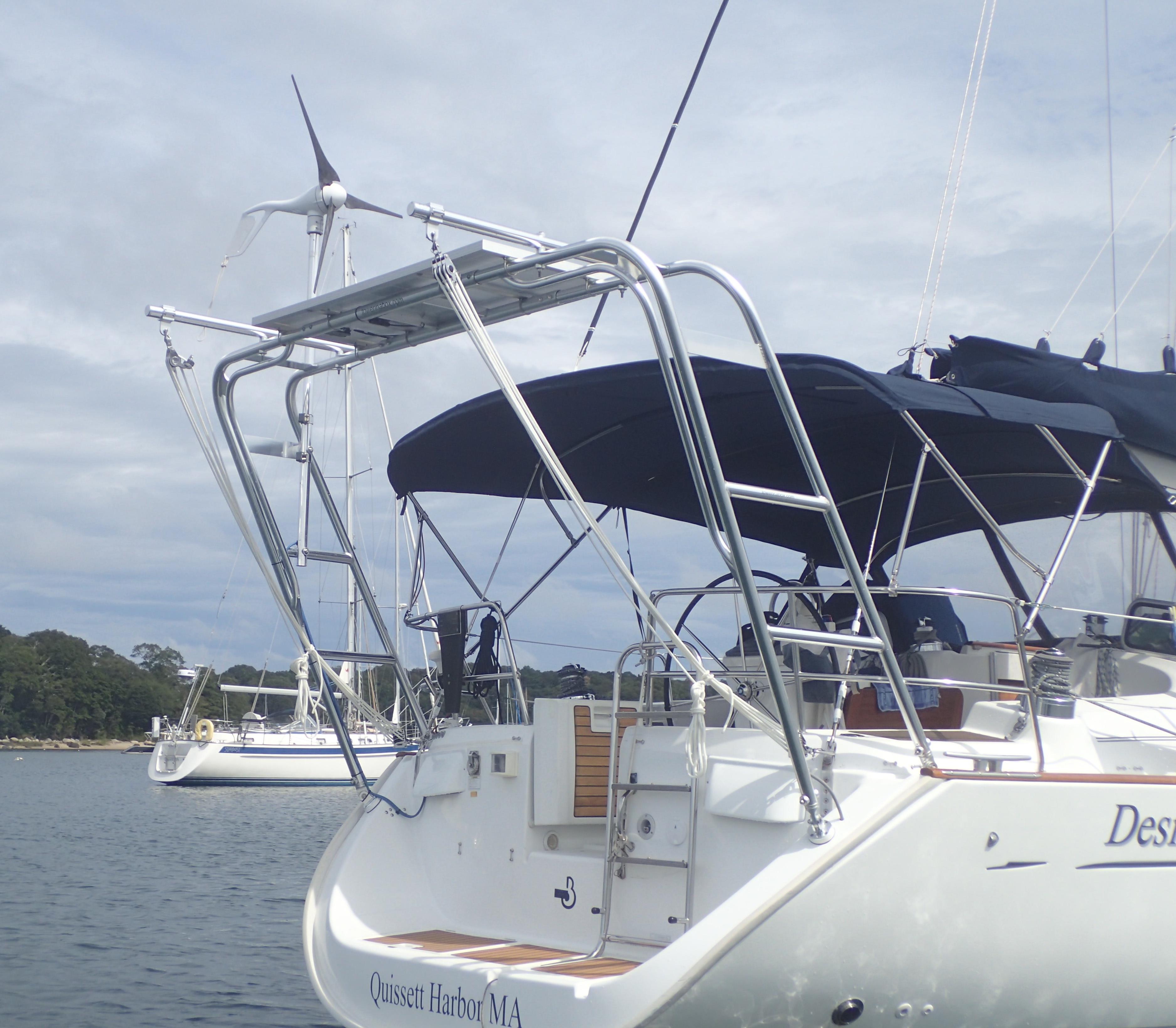 Atlantic Towers Arch installed on the stern of a Beneteau sailboat, with solar panels and wind turbine visible on the arch.
