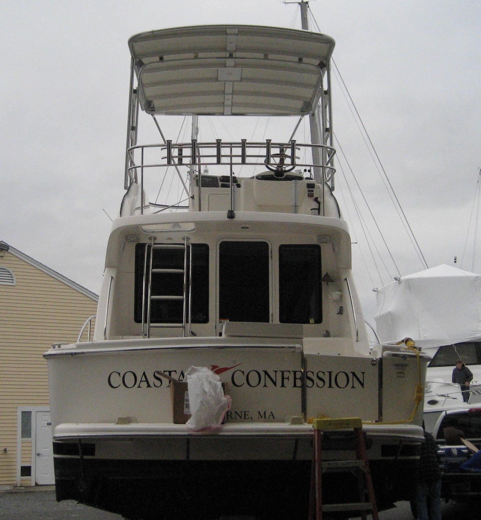Atlantic Towers Top installed on a Riviera boat named "Coastal Confession," with a view of the rear and deck area.