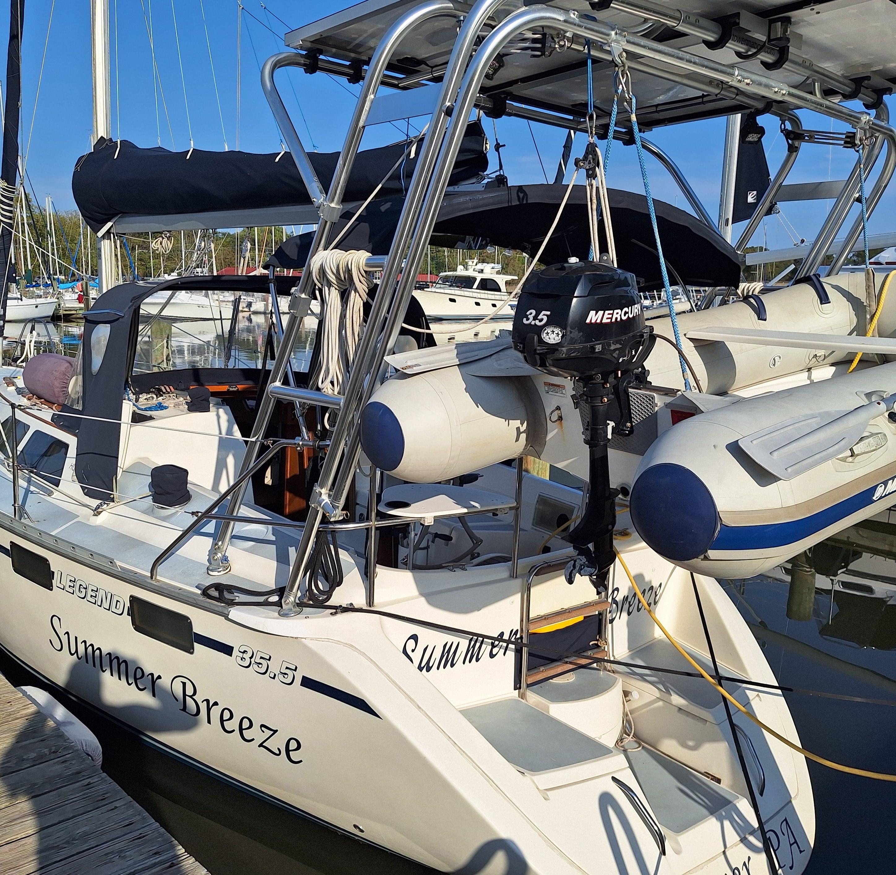 Atlantic Towers Arch installed on a Hunter sailboat named 'Summer Breeze,' anchored at a marina.