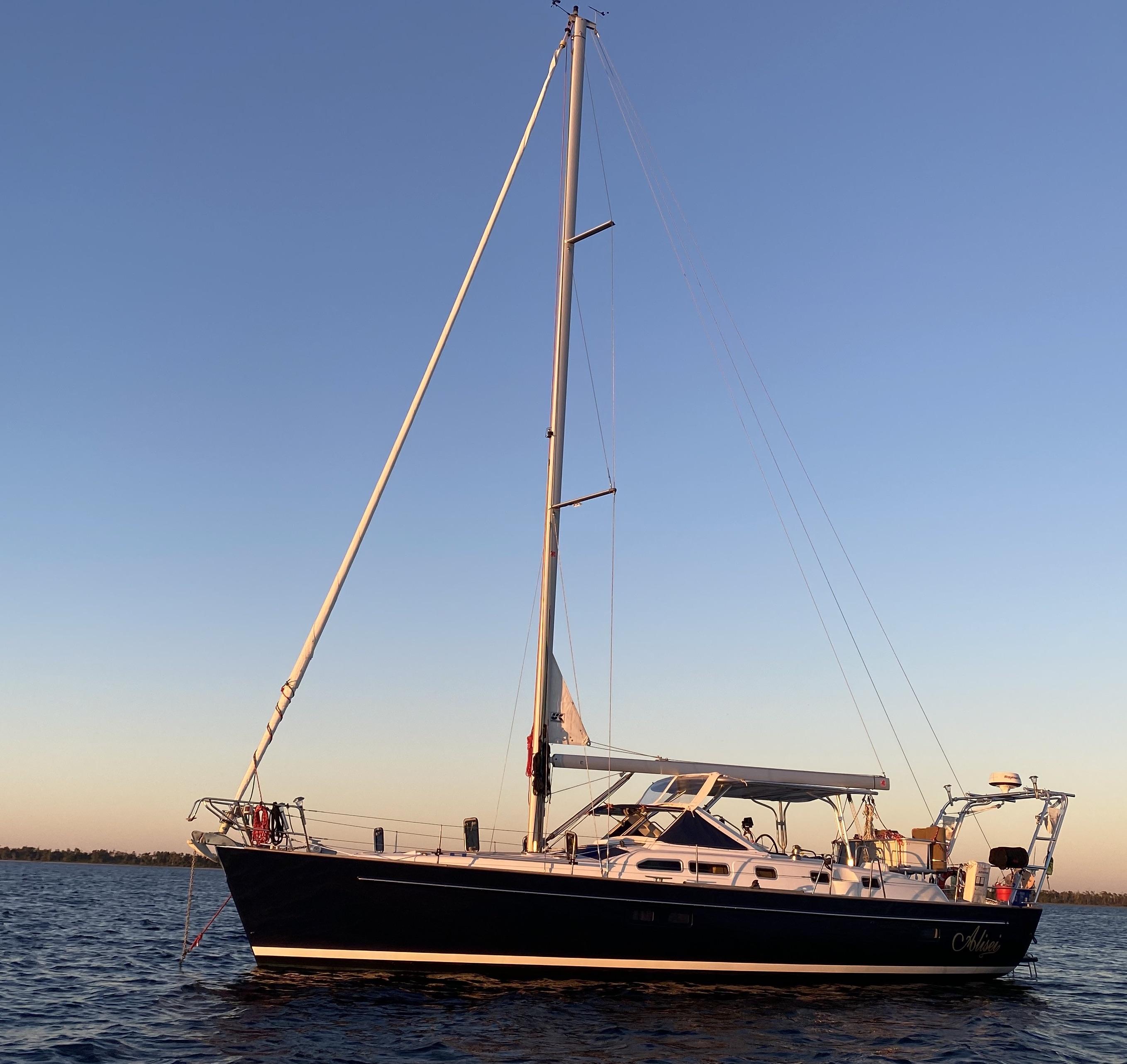Atlantic Towers Arch installed on a Beneteau sailboat at sunset, showcasing the vessel's sleek design and structure.