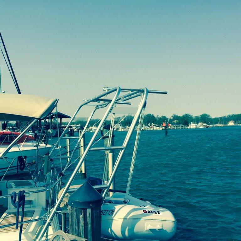 Atlantic Towers Arch installed on a Beneteau boat docked at a marina with calm water and clear sky background.