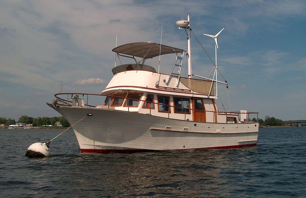 Atlantic Towers Top installed on a classic boat floating on calm waters, with a clear blue sky in the background.
