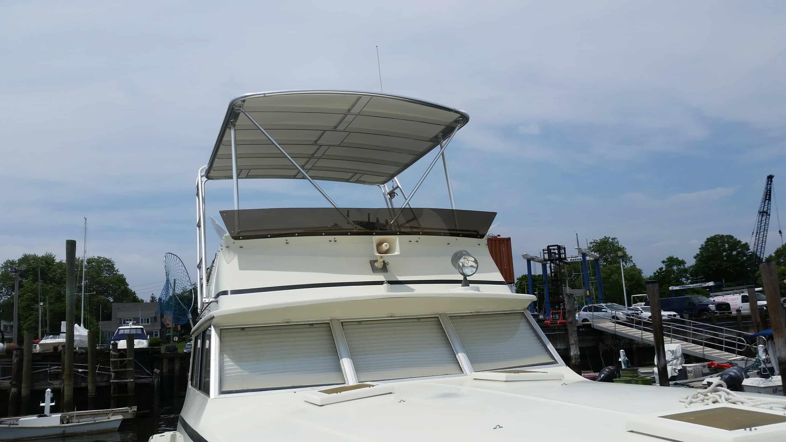 Atlantic Towers Top installed on a boat, showcasing a clear sky and marina setting in the background.