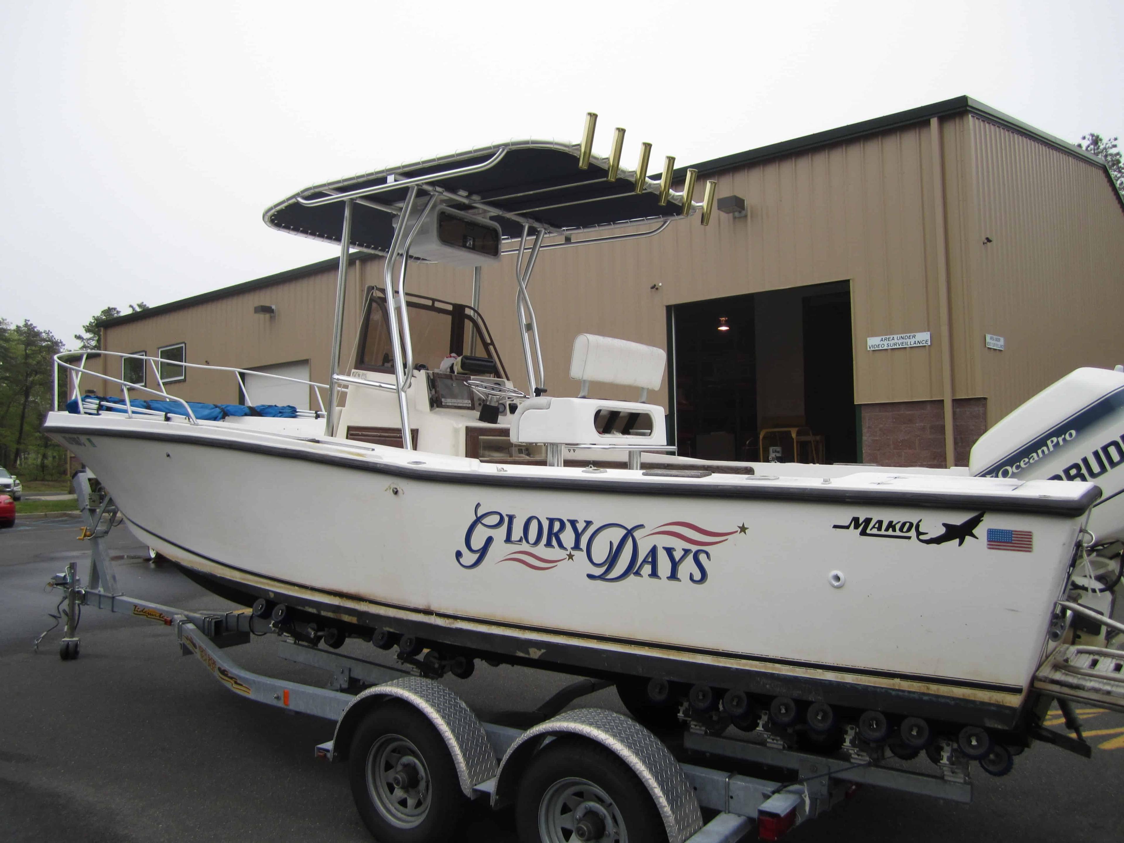 Atlantic Towers T-Top installed on a Mako 254 center console boat, showing a black frame and canvas roof.