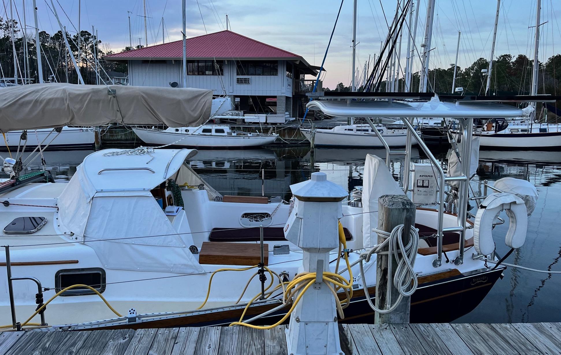Atlantic Towers Top installed on a Shannon boat, docked at a marina with other boats in the background.