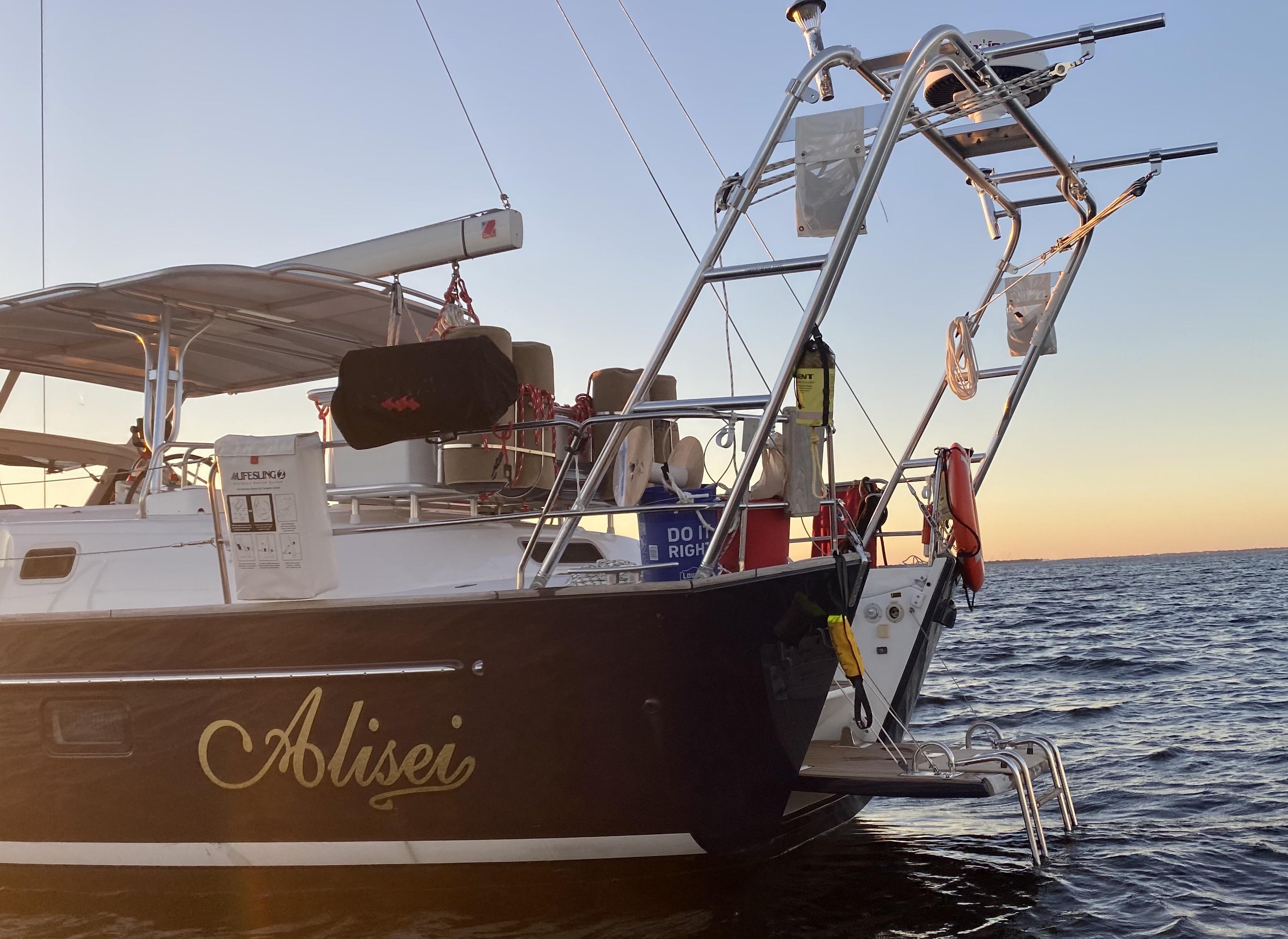 Atlantic Towers Arch mounted on a Beneteau boat, with sunset reflected on the water in the background.