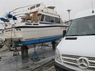 Atlantic Towers T-Top installed on a boat supported on stands at a dockyard with a white van in foreground.