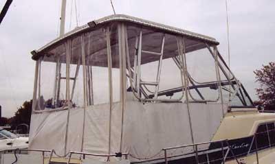 Atlantic Towers Top installed on a Chris Craft 350 Catalina tricabin boat docked by the waterfront.