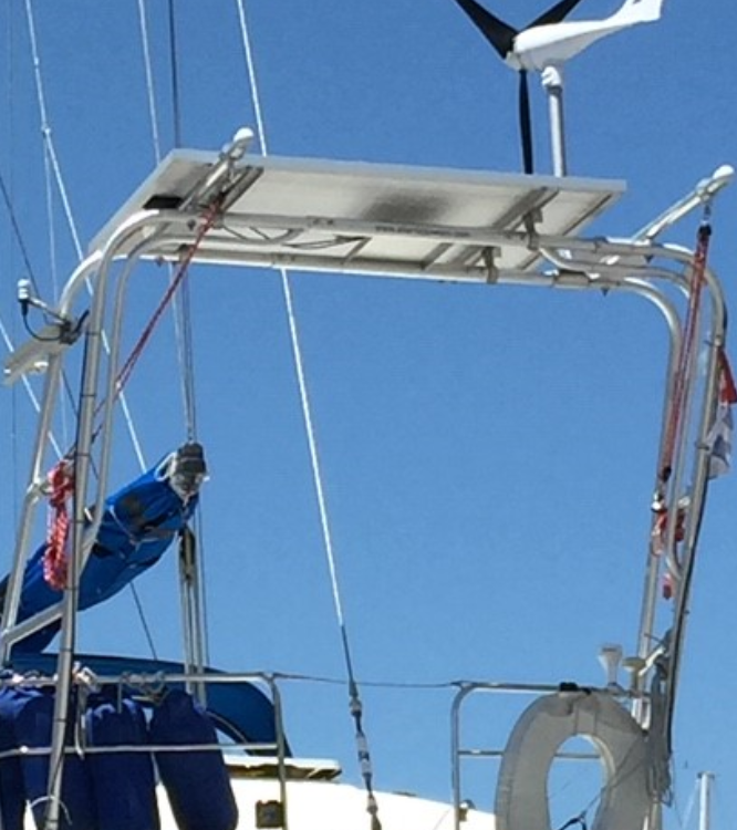 Atlantic Towers Arch installed on a Moody boat, featuring a sturdy design against a clear blue sky.