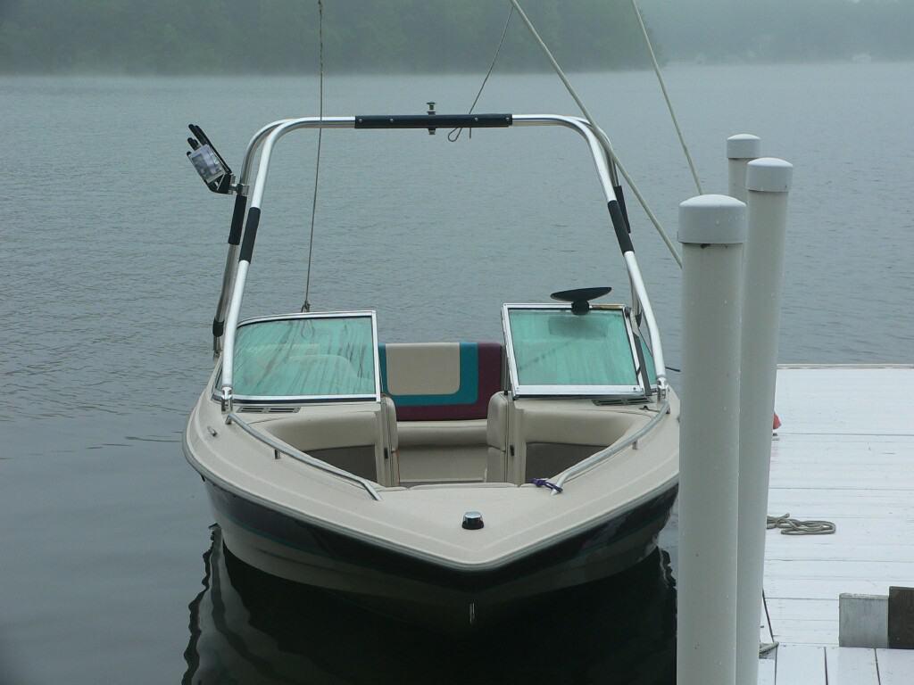 Atlantic Towers Air Tower installed on a boat docked at a serene lake, partially shrouded in mist.