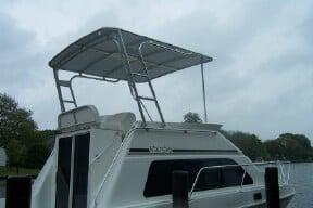 Atlantic Towers Top installed on a Mainship boat, showcasing a spacious and sturdy design.