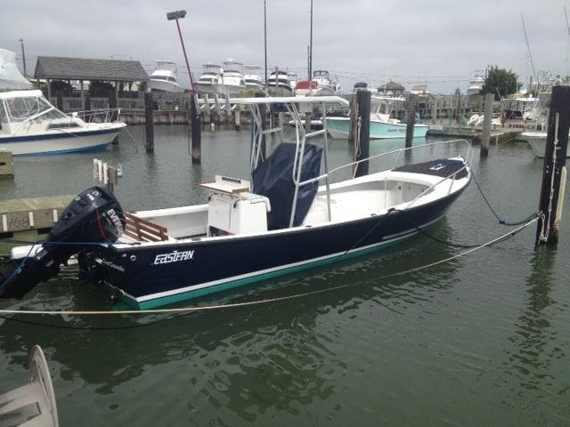 Atlantic Towers T-Top on Eastern Boats 21 center console, providing shade and support for fishing activities.