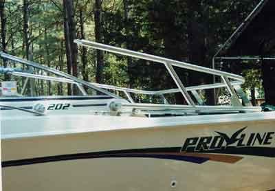 Atlantic Towers Arch installed on a Pro Line 202 boat, featuring a sleek design in a wooded setting.