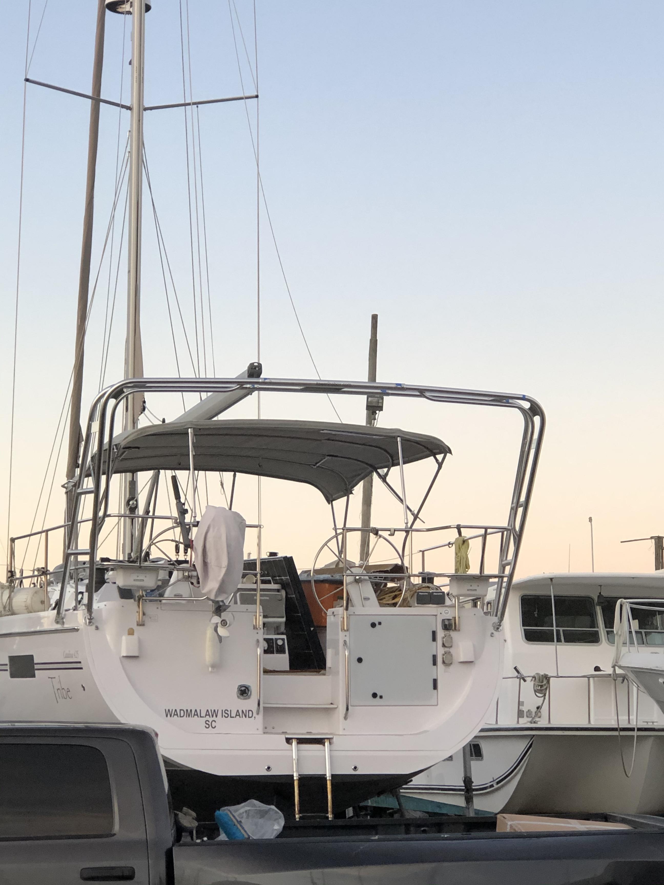 Atlantic Towers Arch installed on a Catalina sailboat, showcasing the stern and surrounding marina setting at dusk.