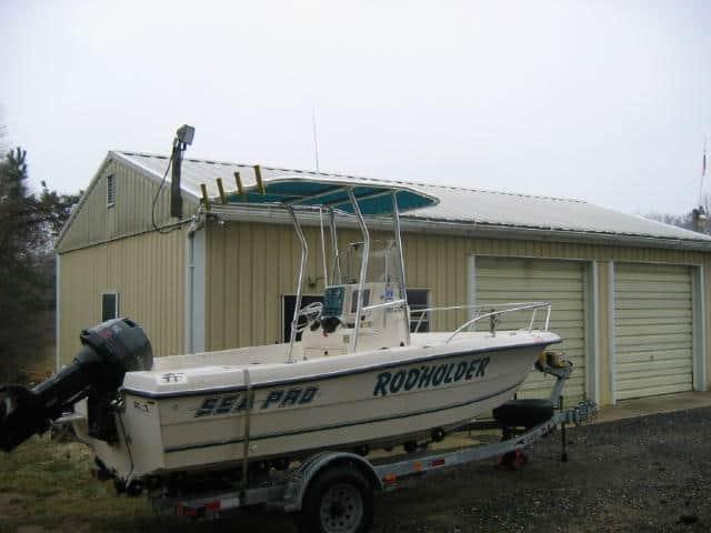 Atlantic Towers T-Top installed on a Sea Pro 190 center console boat shown from the side on water.