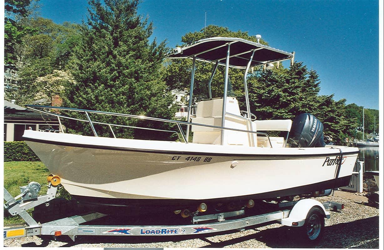 Atlantic Towers T-Top installed on a Parker 180 Center Console boat, displayed on a trailer in a residential area.