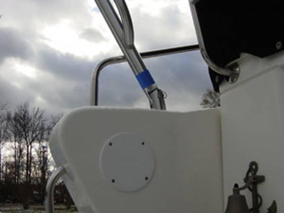 Close-up view of the Atlantic Towers Arch installed on the Silverton 350 Convertible boat, showing stainless steel framework against a cloudy sky.