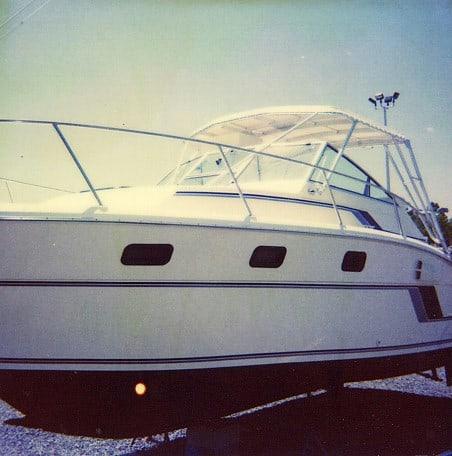 Atlantic Towers Top installed on an Aquasport 286/290 Express boat with a white hull.