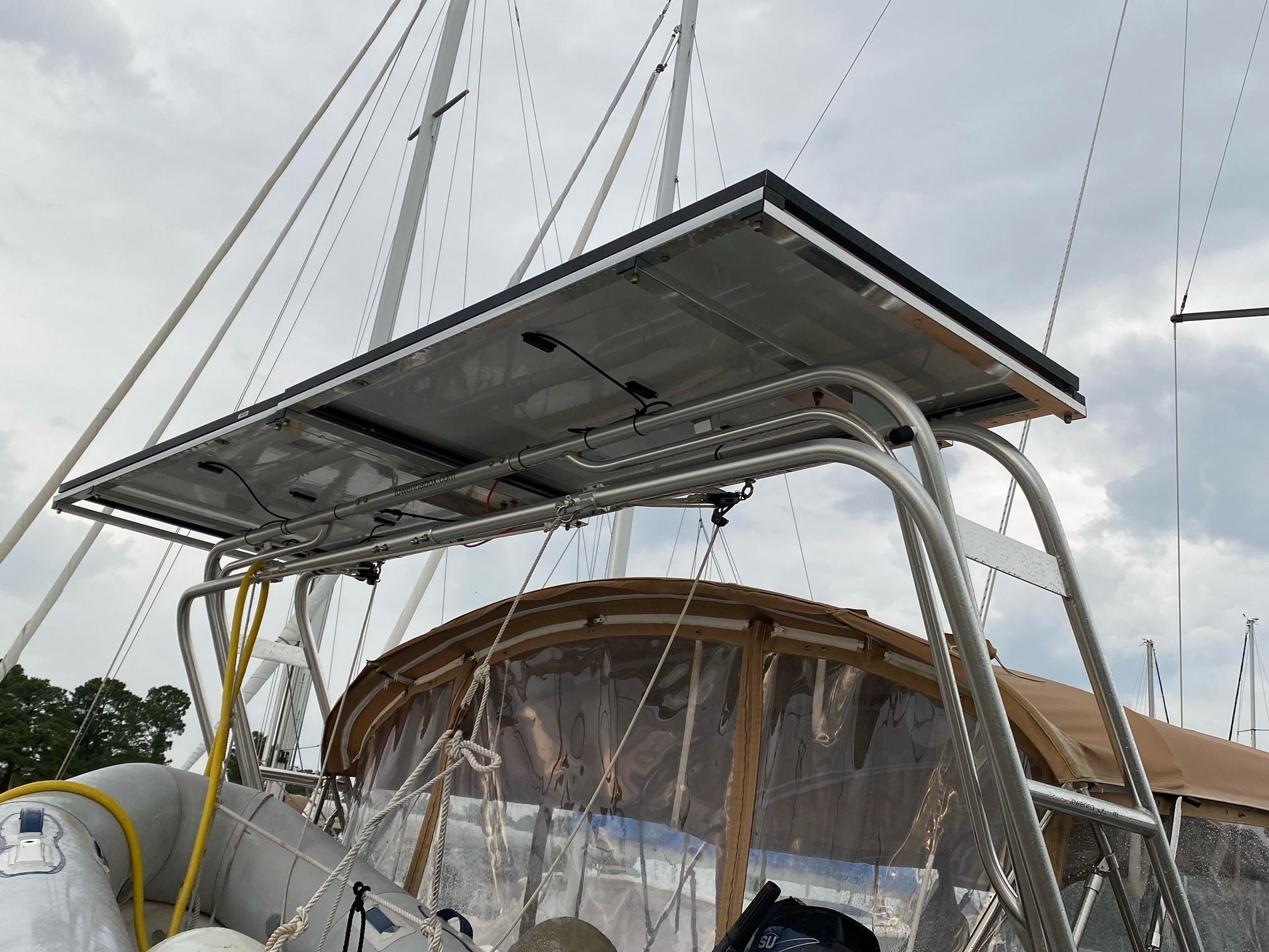 Atlantic Towers arch installed on a Catalina sailboat, supporting a solar panel overhead above the cockpit area.