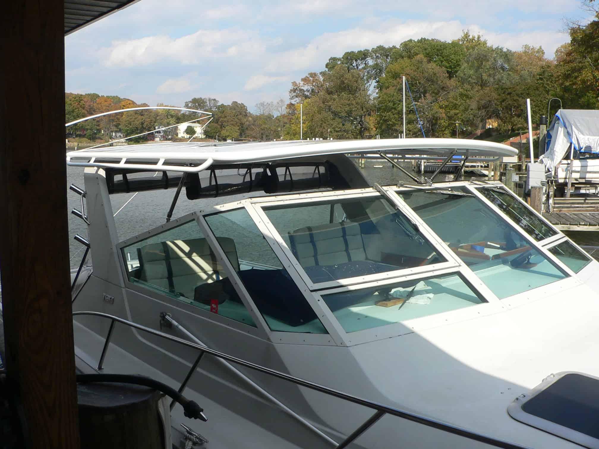 Atlantic Towers Top installed on a Tiara 3600 Open express boat docked in a marina under clear skies.