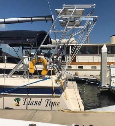 Atlantic Towers Arch installed on an Island Packet boat named Island Time docked at a marina with a lifebuoy attached.