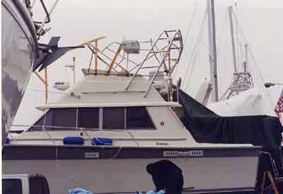Atlantic Towers Arch installed on Silverton 37 Convertible boat docked alongside other vessels in a marina.