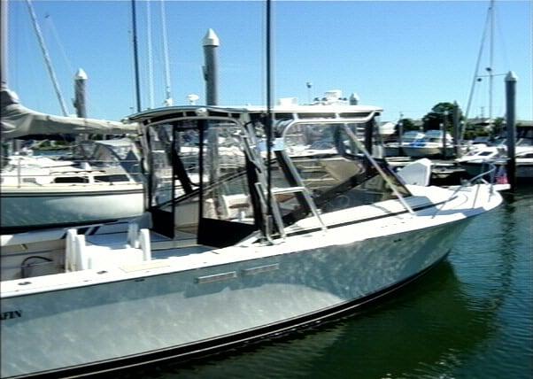 Atlantic Towers Top installed on a Blackfin 27 Combi boat docked at a marina on calm water.