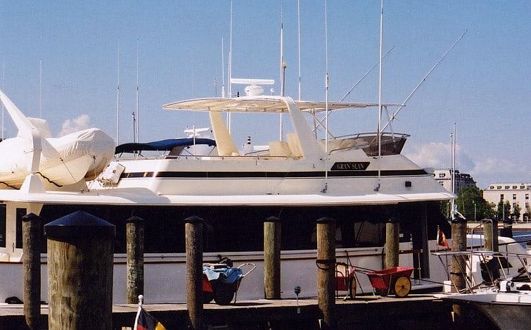 Hattaras 63 Motoryacht docked with Atlantic Towers Top installed on its top deck under clear sky.