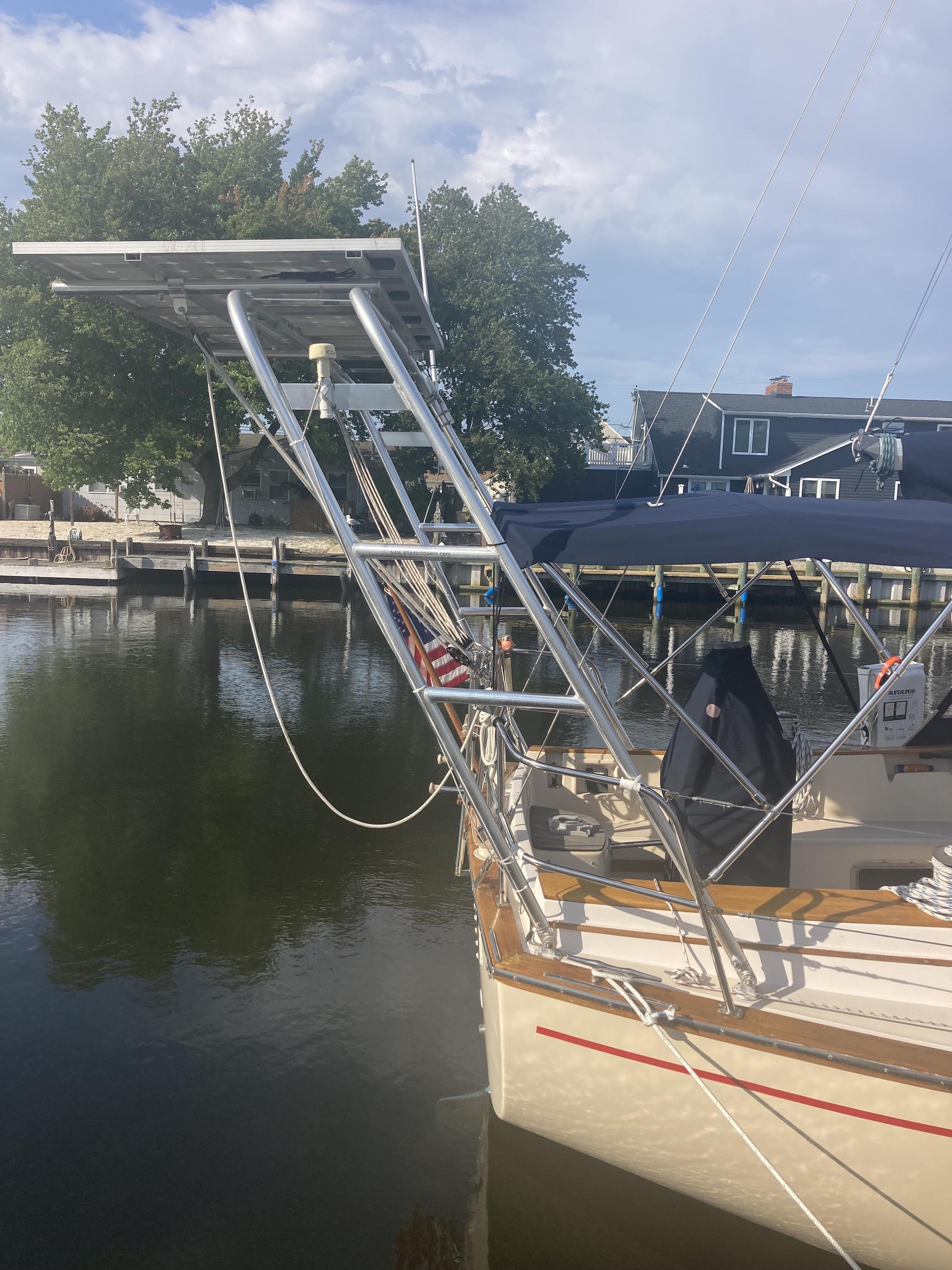 Atlantic Towers Arch mounted on an Island Packet boat, featuring a polished metal frame and a solar panel.