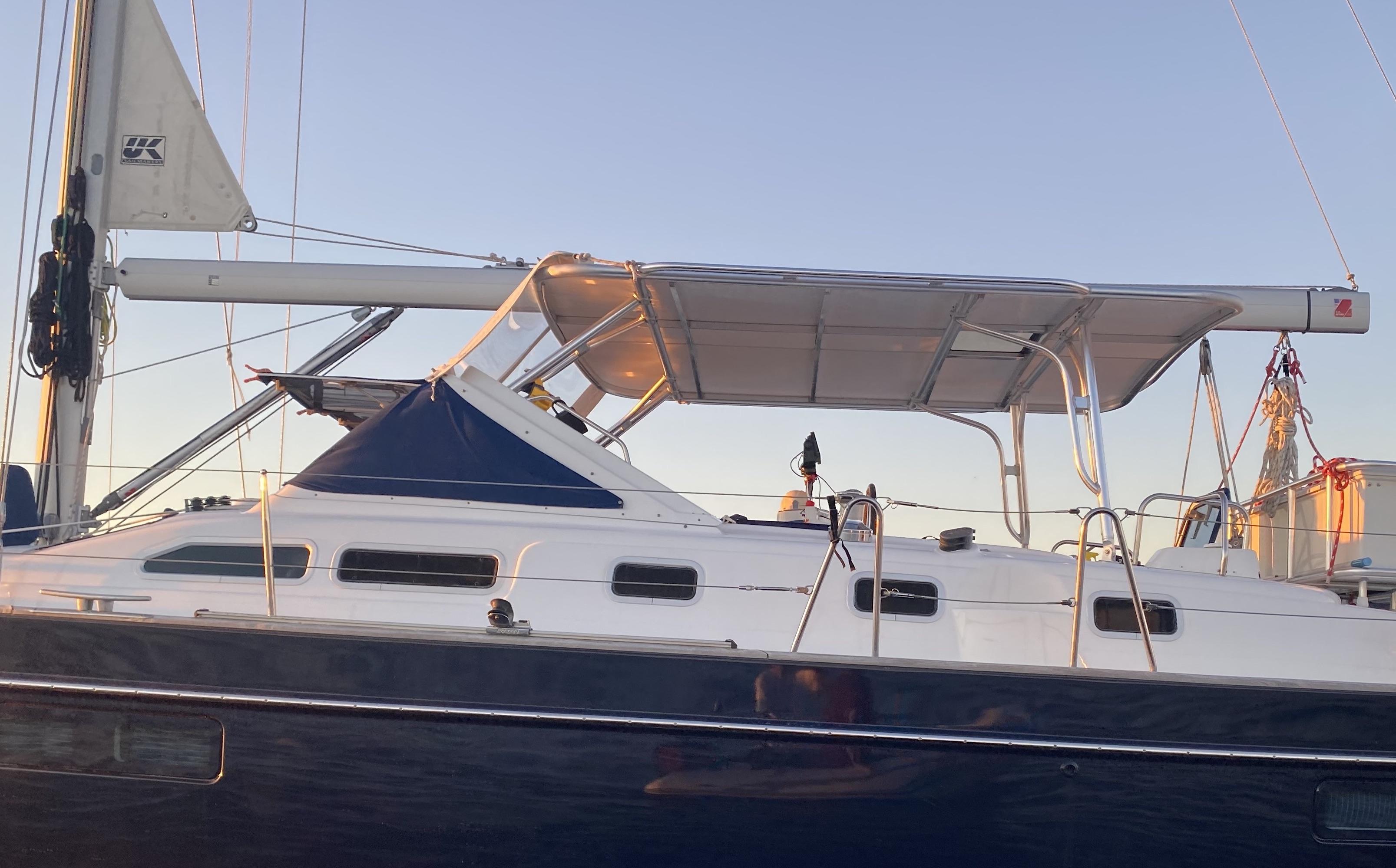 Beneteau sailboat with installed Atlantic Towers Top frame providing shade over the cockpit area in the evening light.