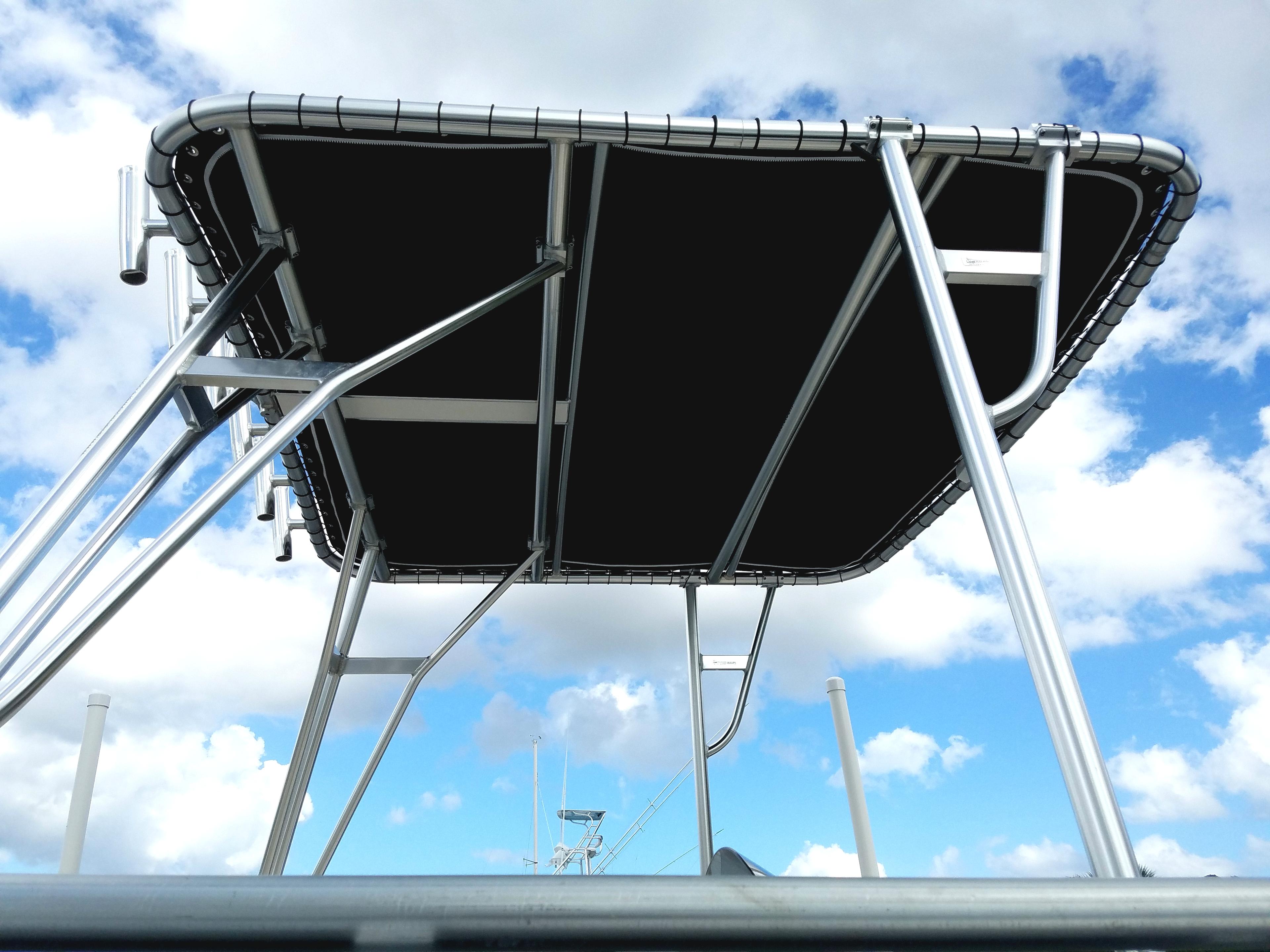 Atlantic Towers Top installed on a Bennington boat, featuring a black canopy supported by polished metal frame.