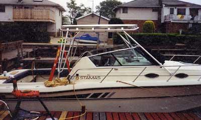 Atlantic Towers Top installed on a Stamas 288 Liberty Family Fisherman boat at a dock.