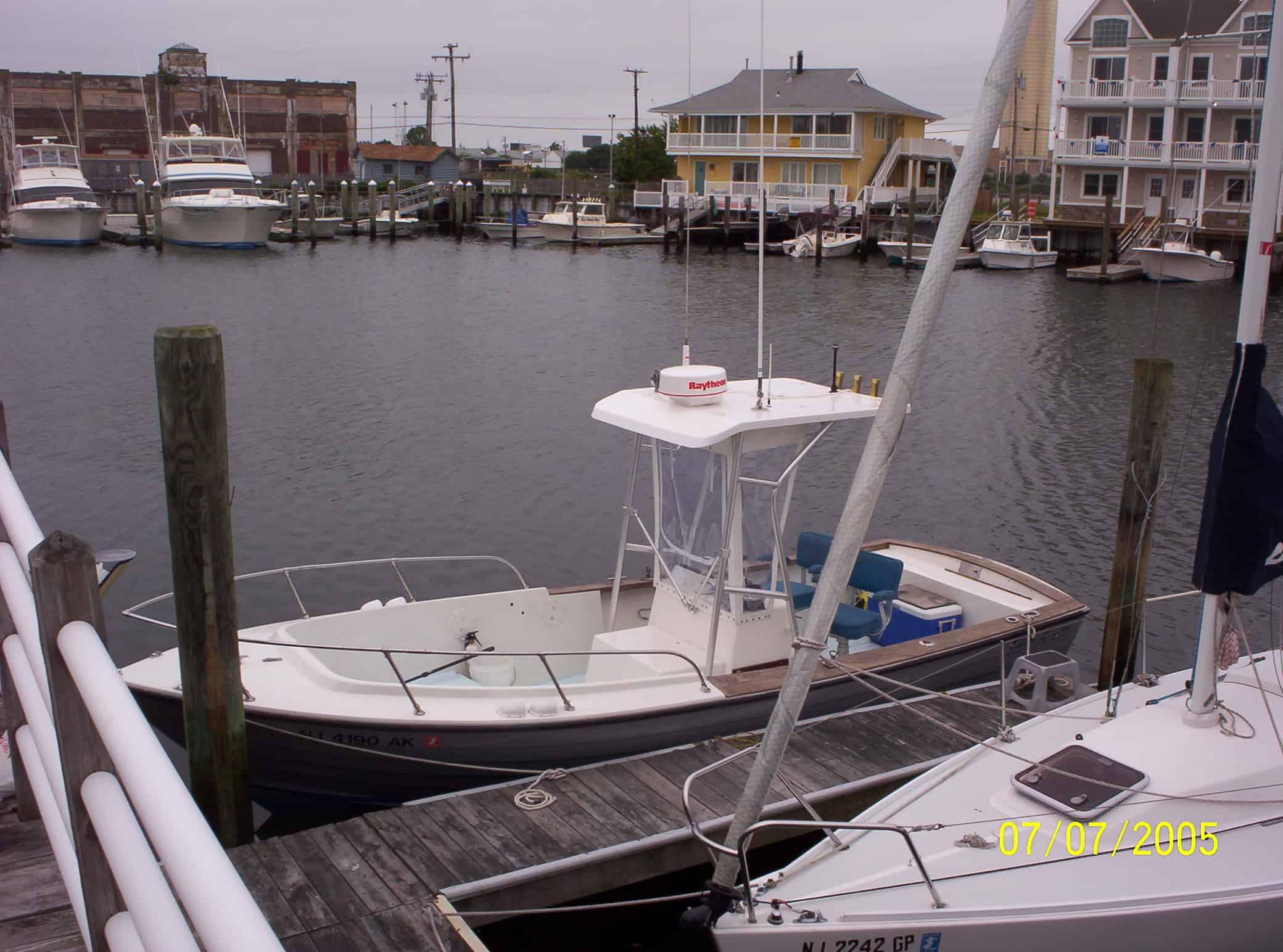 Atlantic Towers T-Top installed on a Chris Craft 22 Dory center console boat shown from the side angle.