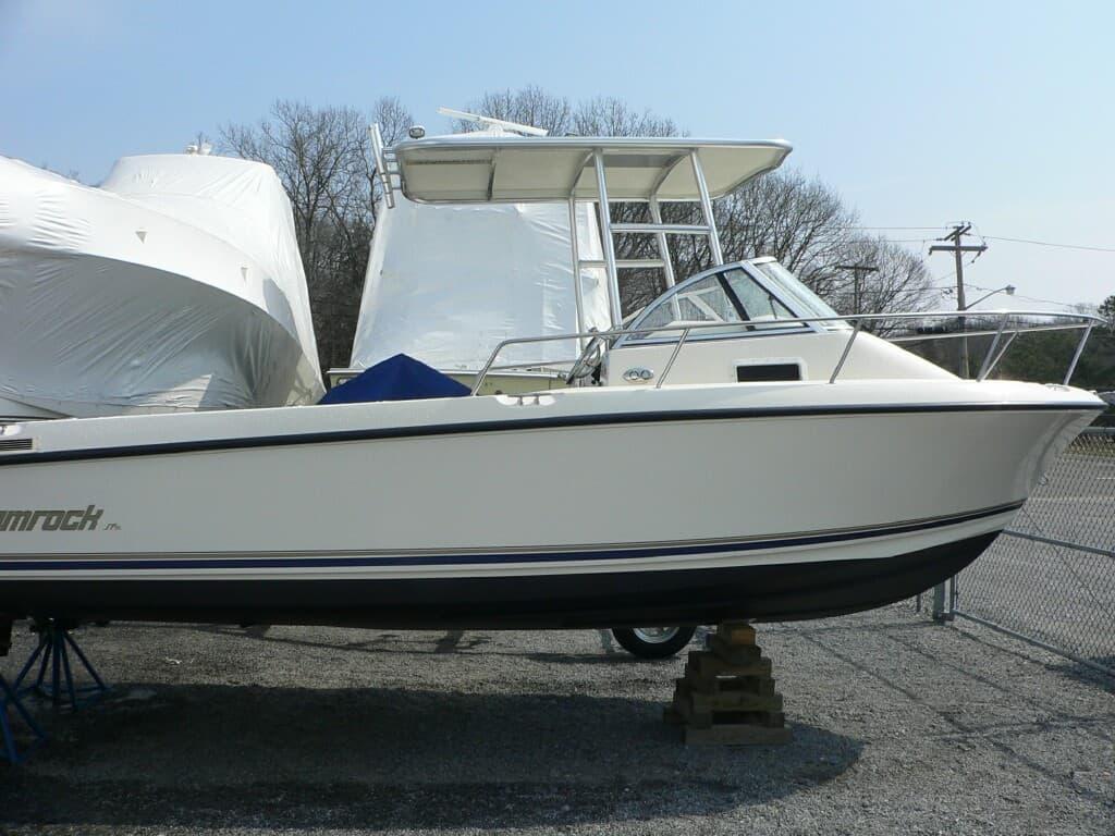 Atlantic Towers Top installed on a Shamrock 219 Walkaround boat, displayed on a trailer in a storage area.