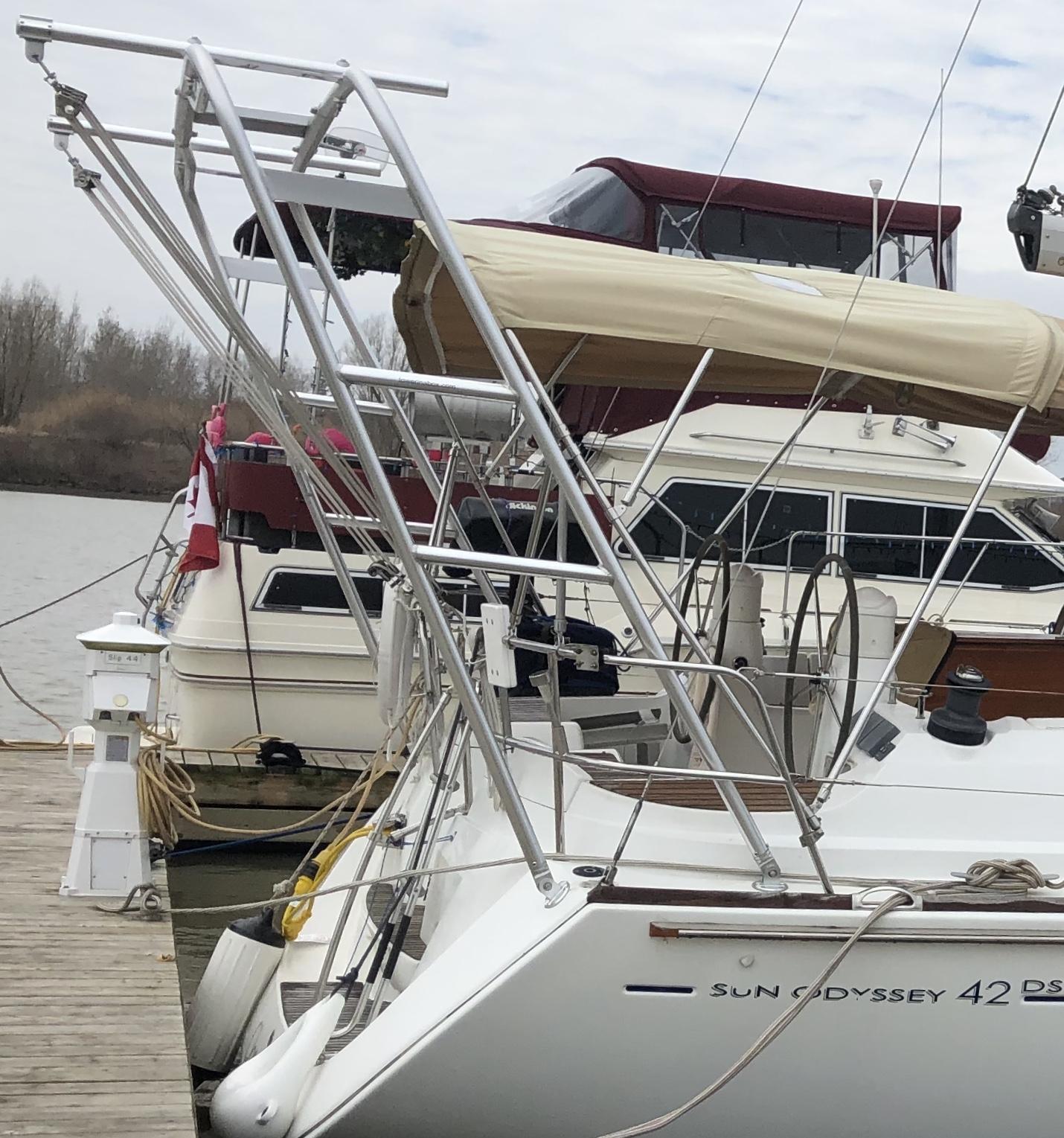 Atlantic Towers Arch mounted on the stern of a Jeanneau Sun Odyssey 42 DS sailboat docked at a marina.