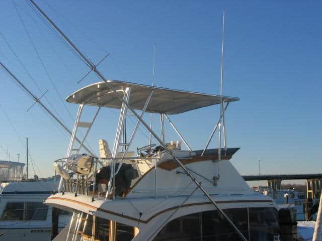 Post Yachts 40 Sport Fish boat with Atlantic Towers Top installed, docked with clear blue sky in background.