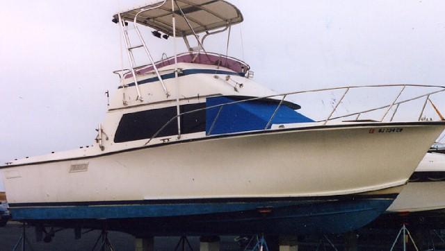 Atlantic Towers Top installed on a Pacemaker boat, featuring a white hull and a bimini top.
