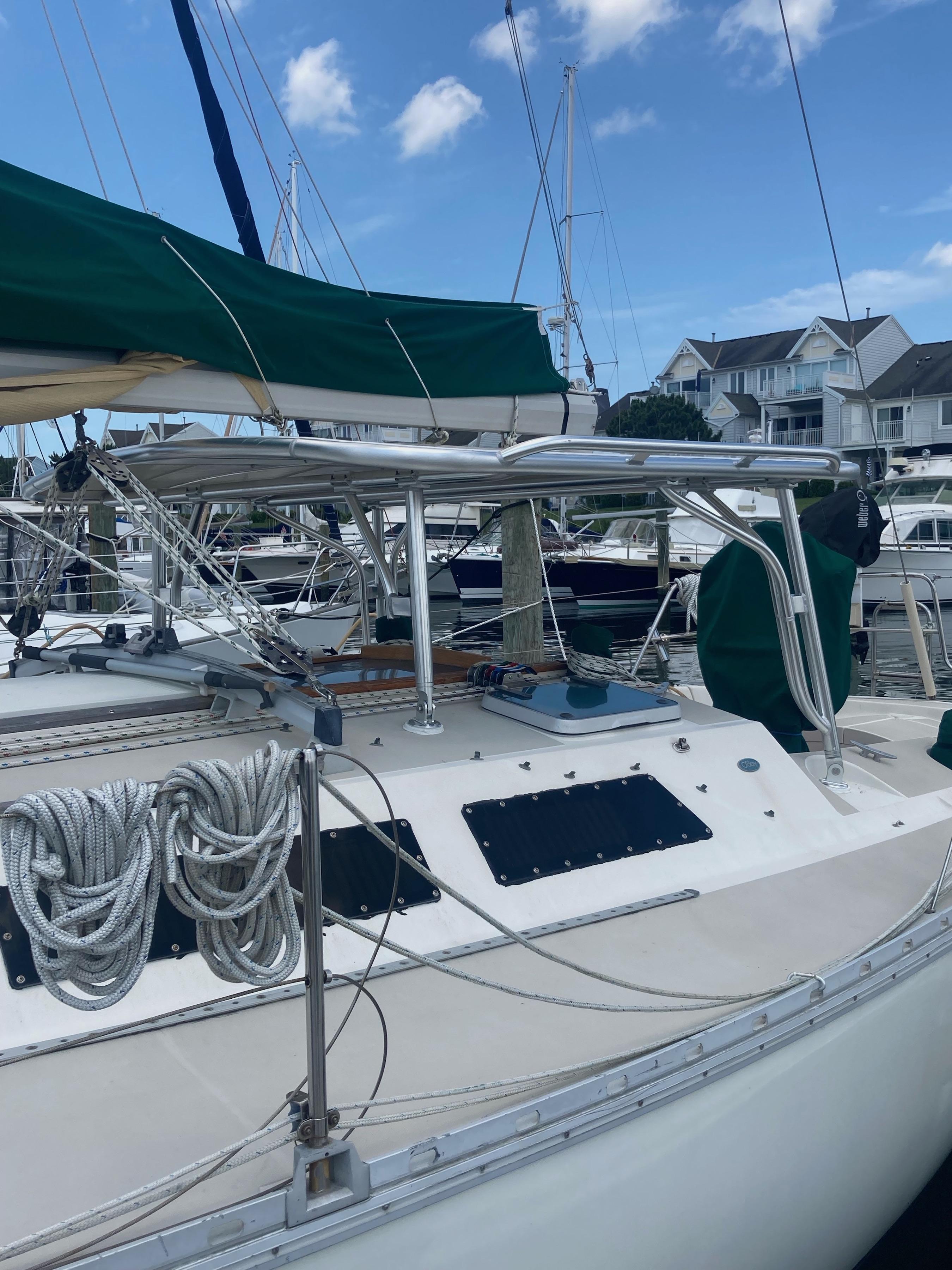 Atlantic Towers Top installed on an O'Day boat, featuring green canvas and deck details at a marina.
