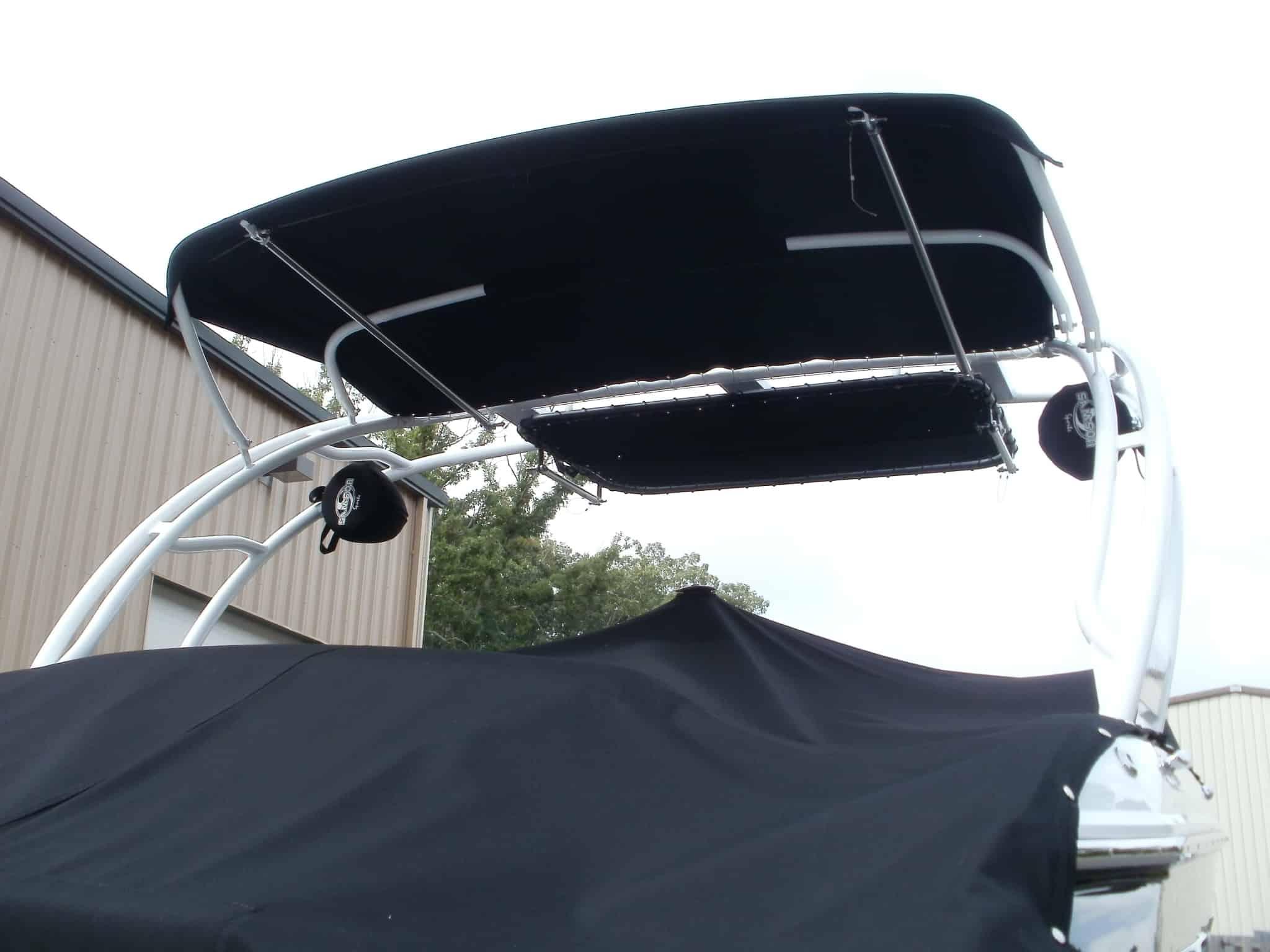 Atlantic Towers Arch installed on a Cobalt A25 boat, viewed from below against a cloudy sky.