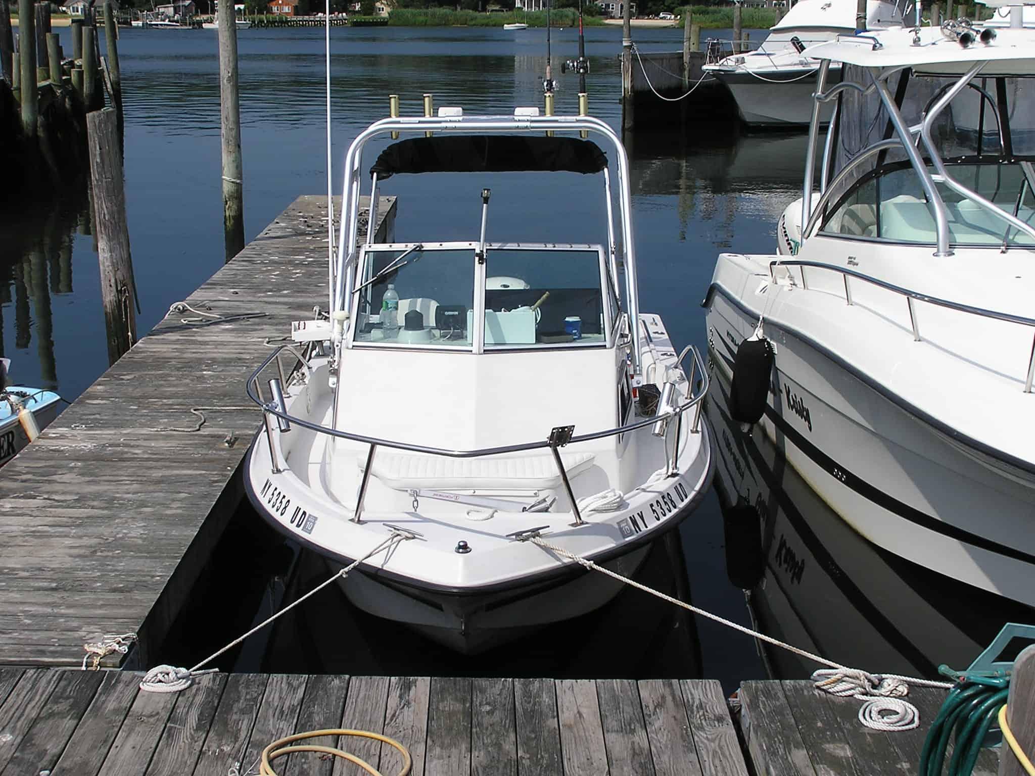 Atlantic Towers arch installed on a Stratos 2050 Walkaround boat, docked at a marina.