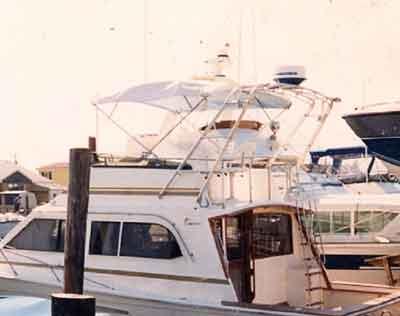 Atlantic Towers Arch installed on an Egg Harbor 41 Sport Fisherman docked at a marina.
