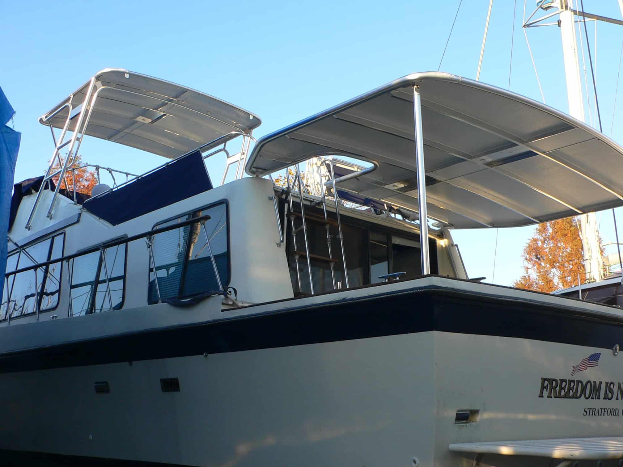 Atlantic Towers Aft Deck Top installed on Blue Water Boats 40 Coastal Cruiser houseboat showing rear deck area.