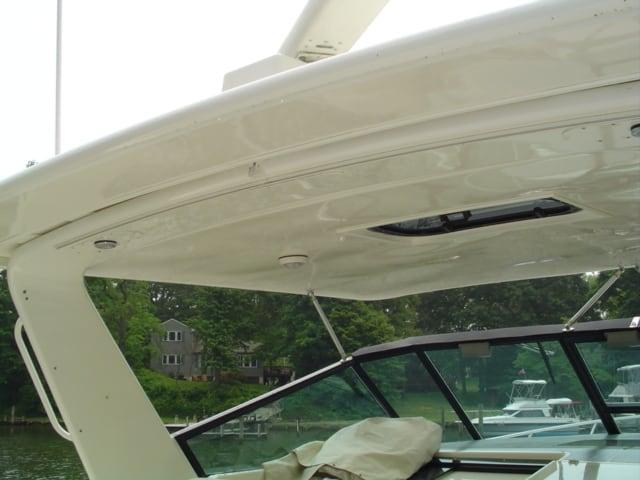 Atlantic Towers Top installed on a Tiara 40 Express boat, showcasing the sleek roof design and surrounding scenery.