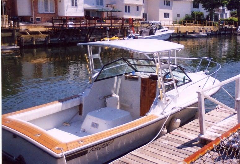 Atlantic Towers Top installed on a 24 Rampage boat docked near residential buildings by the water.
