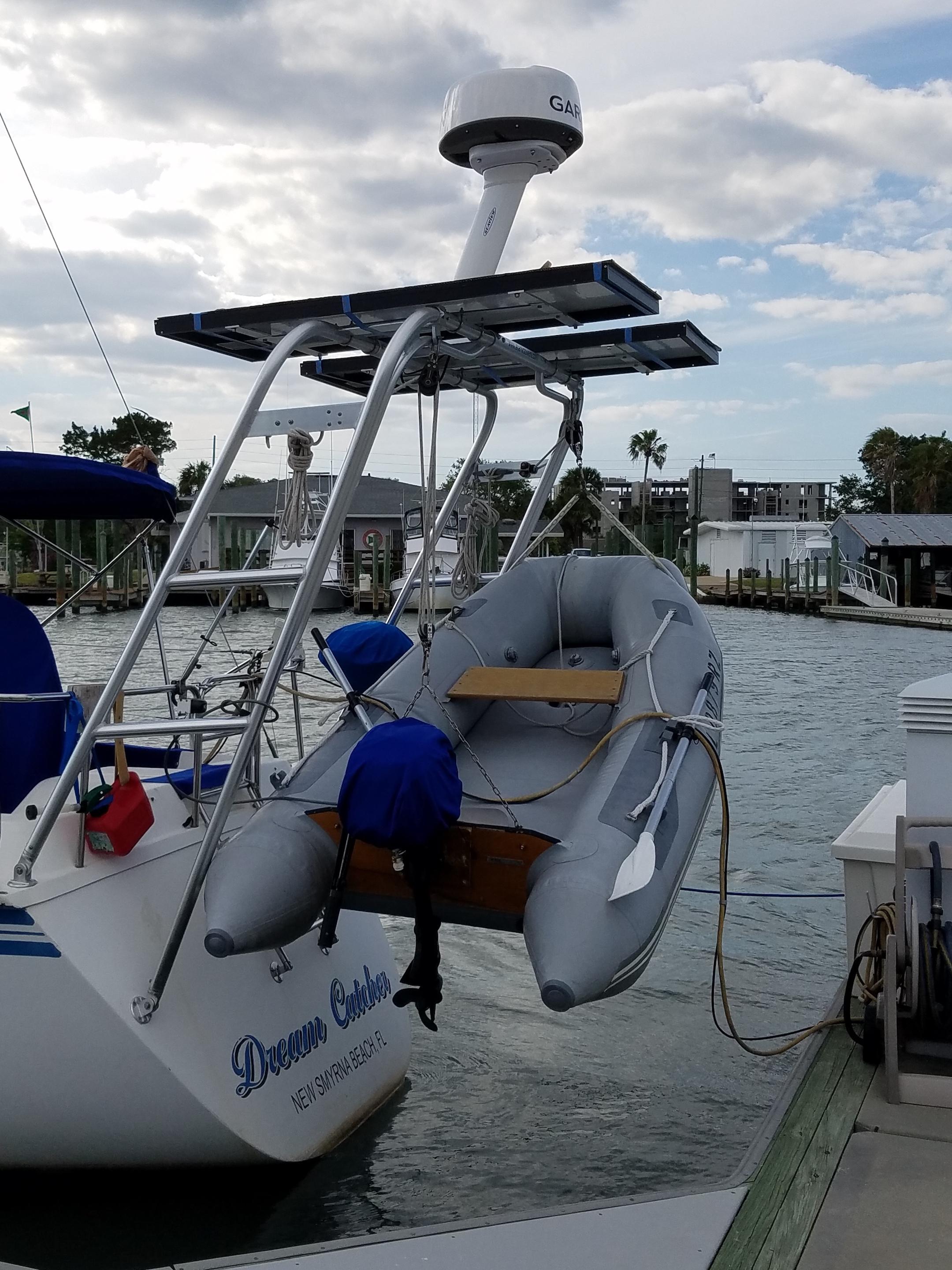 Atlantic Towers Arch mounted on a Hunter boat with an inflatable dinghy, docked by the water.