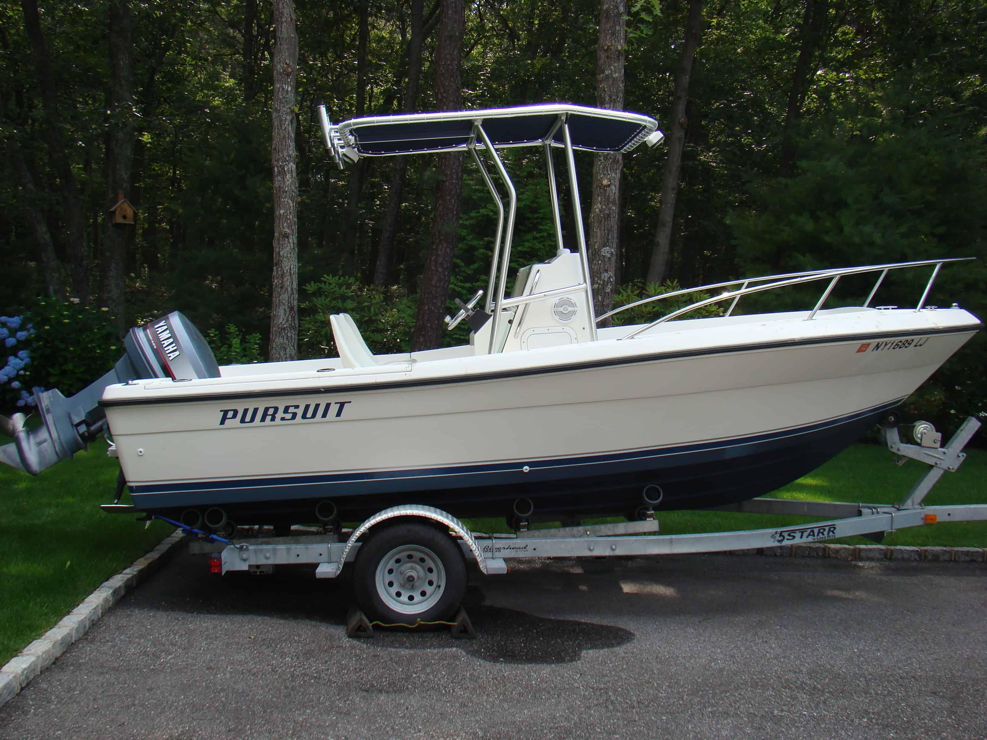 Atlantic Towers T-Top installed on a Pursuit 18 center console boat with windshield and mounted electronics panel