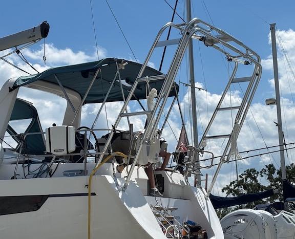 Atlantic Towers Arch installed on a Southerly boat, featuring a robust stainless steel design against a blue sky.