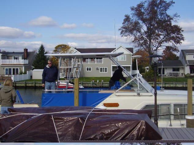 Atlantic Towers Top installed on a Chris Craft 350 Catalina tricabin boat displaying a sleek white arch.