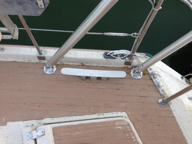 Atlantic Towers arch installed on Amel 53 sailboat with rigging and sails against a clear sky backdrop.